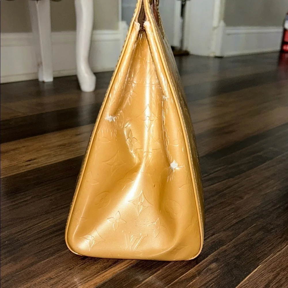 LOUIS VUITTON Gold Tote with Iconic Embossed Design